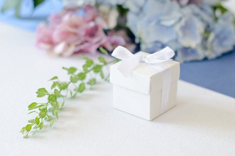 white favour boxes with ribbon